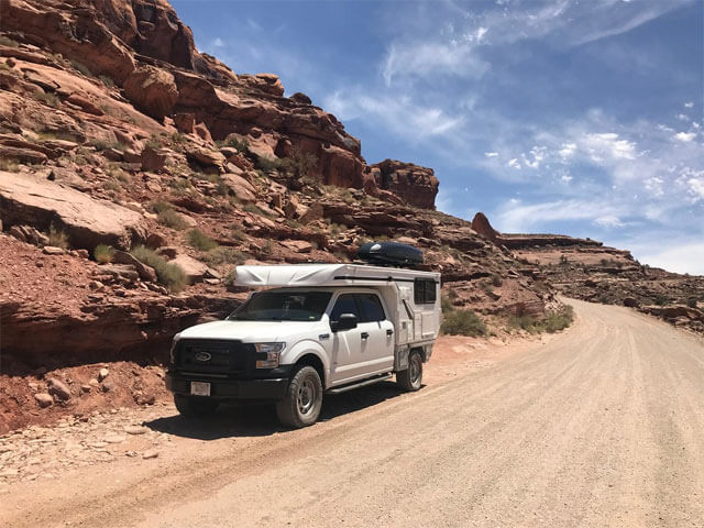 Pop-Up Camper on White Pickup Truck